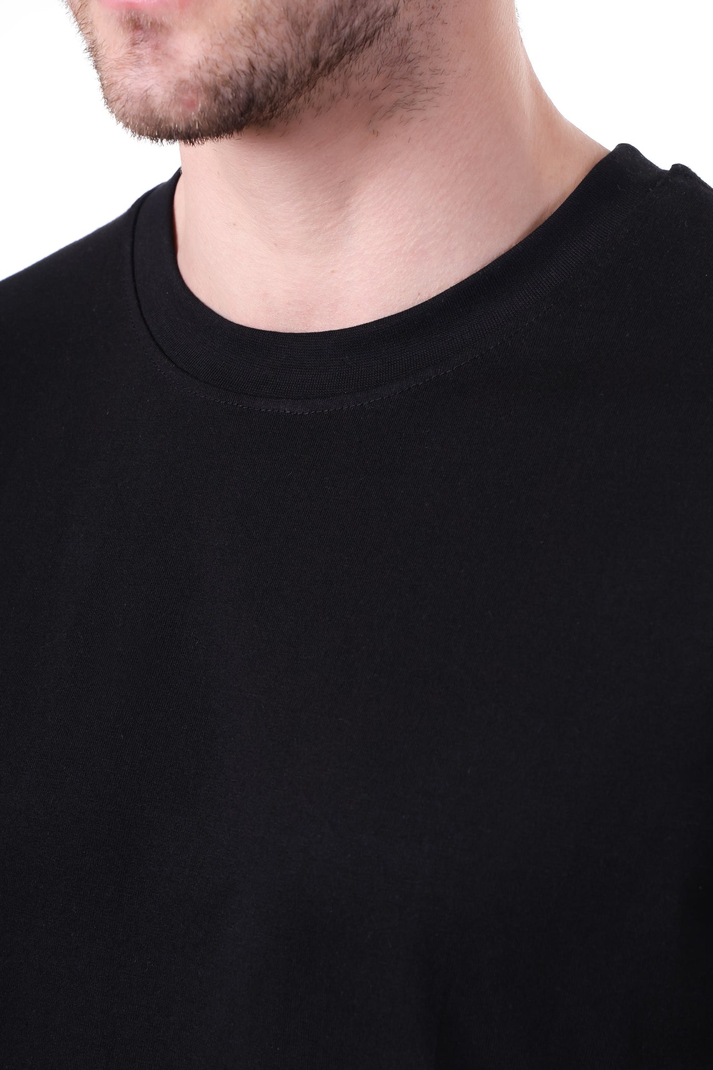 Close-up texture of bio-washed cotton fabric in solid black color