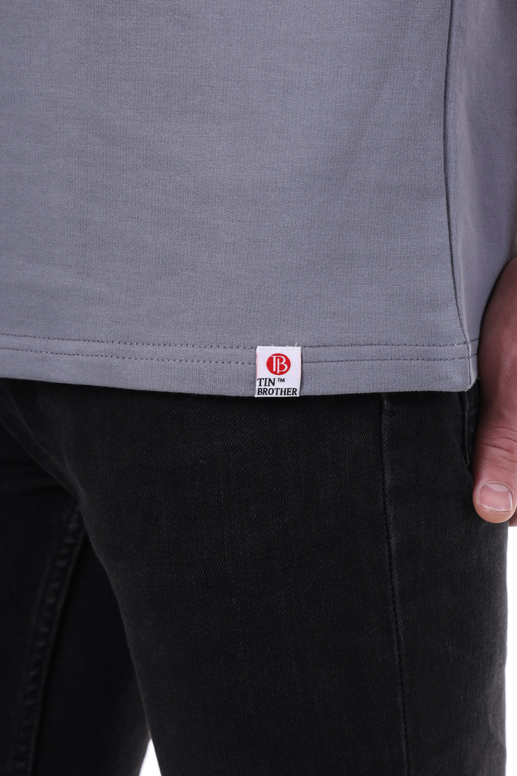 Brand tag close-up on Tin Brother t-shirt – stitched label for premium streetwear branding