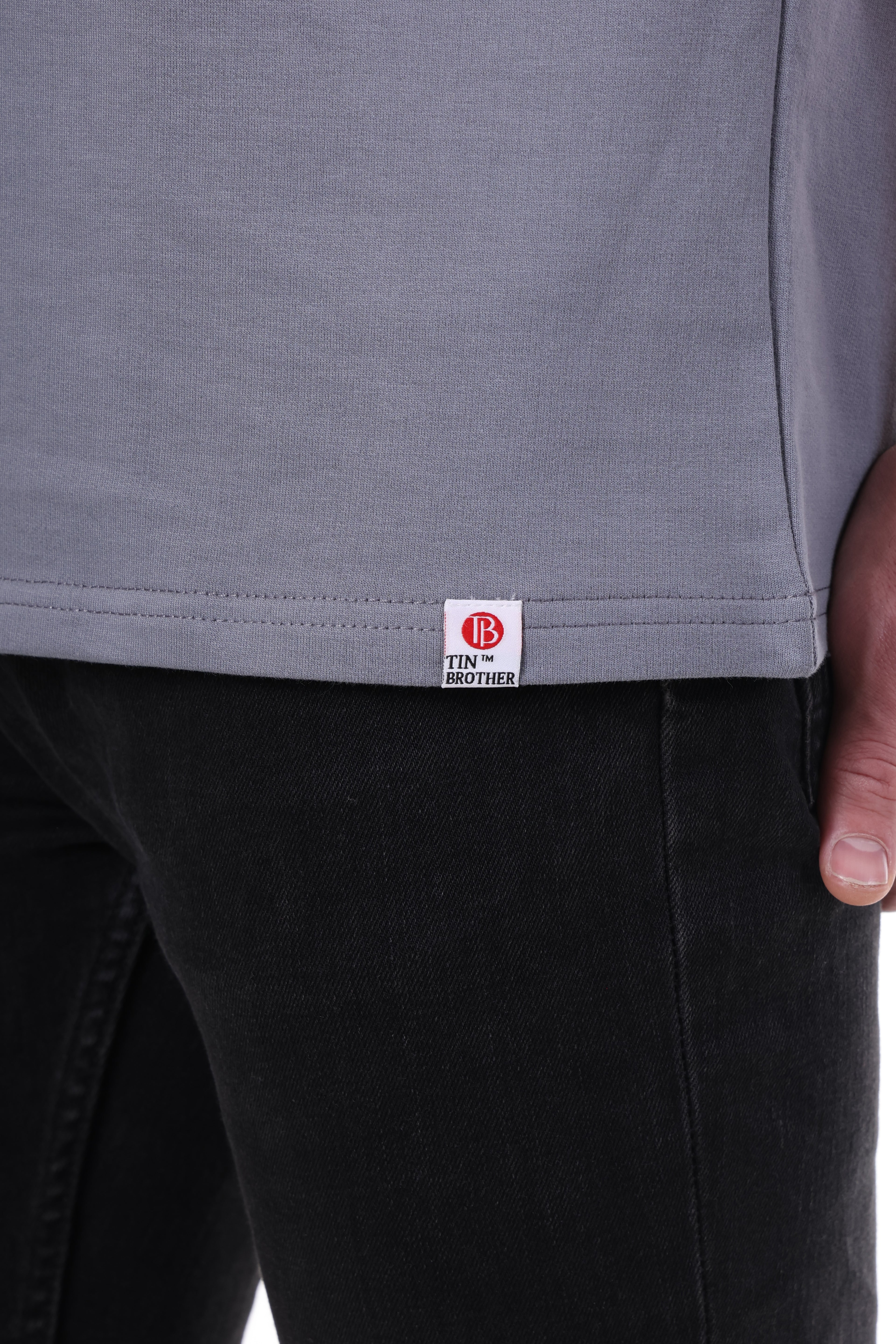 Brand tag close-up on Tin Brother t-shirt – stitched label for premium streetwear branding