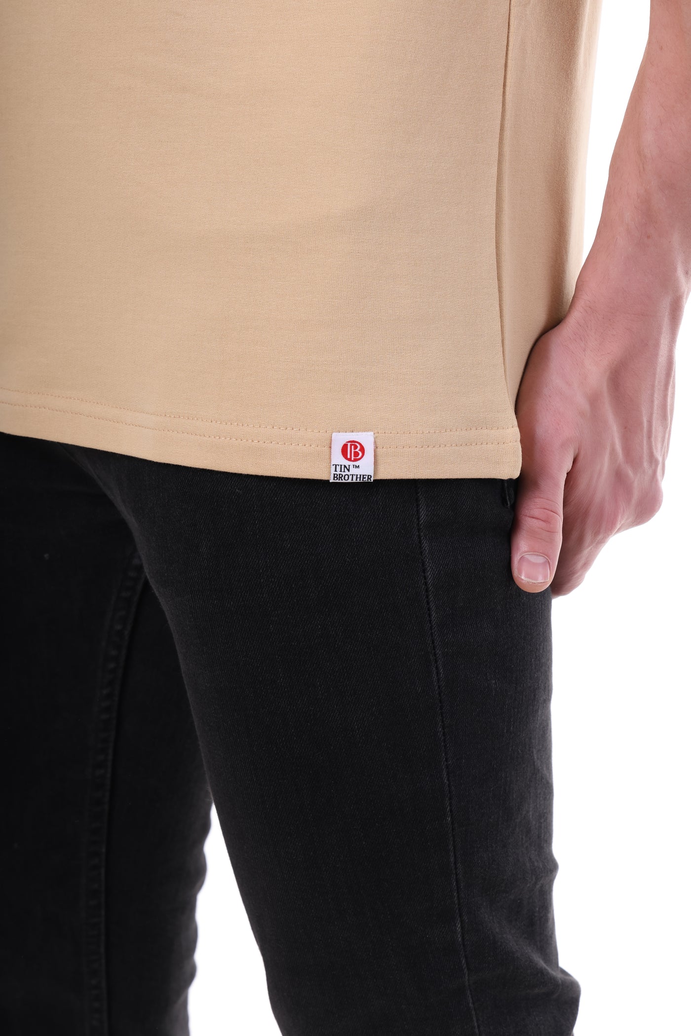 Brand tag close-up shot on Tin Brother t-shirt – stitched label detail for premium finish