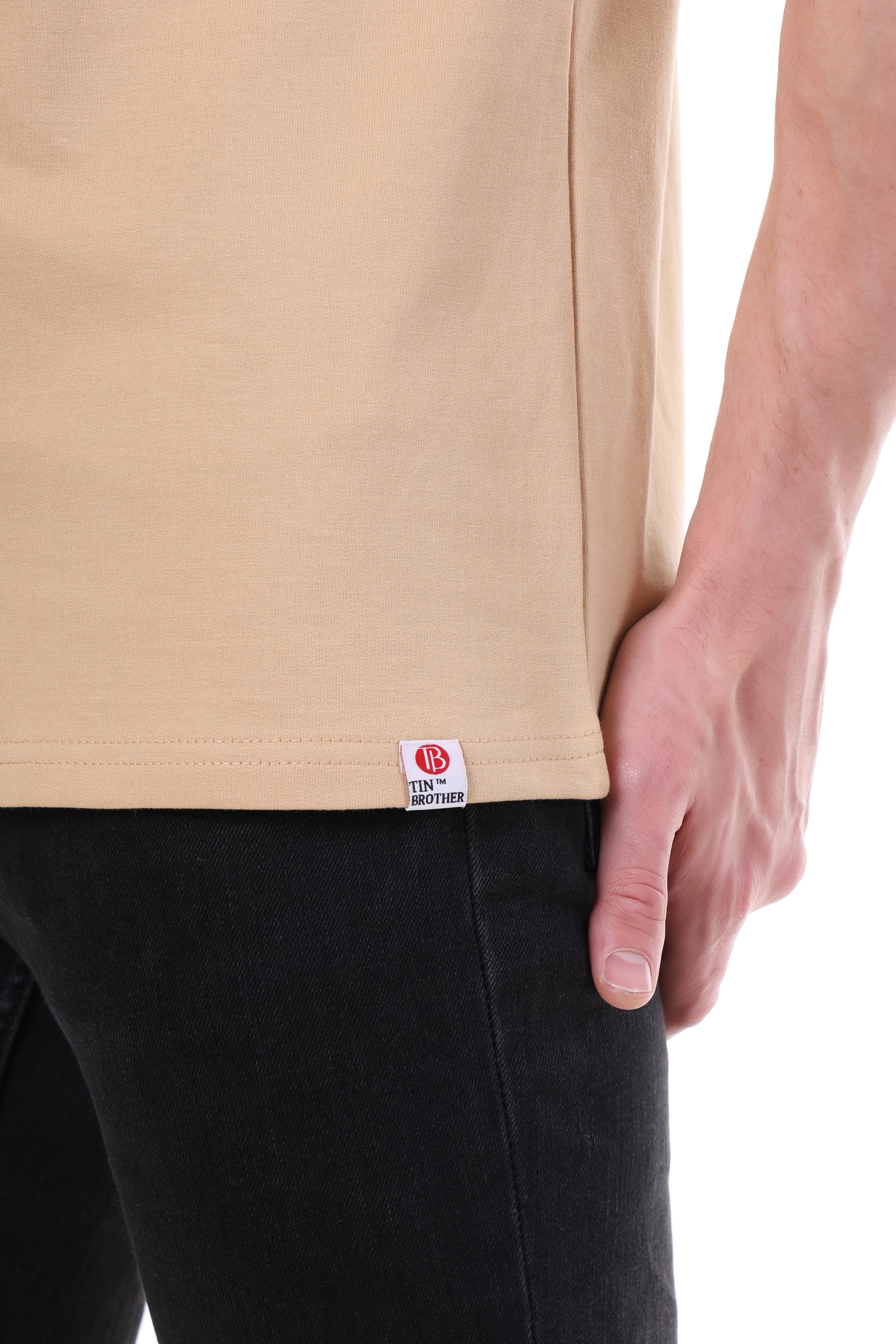 "Close branding and logo tag on Tin Brother Batman tee"